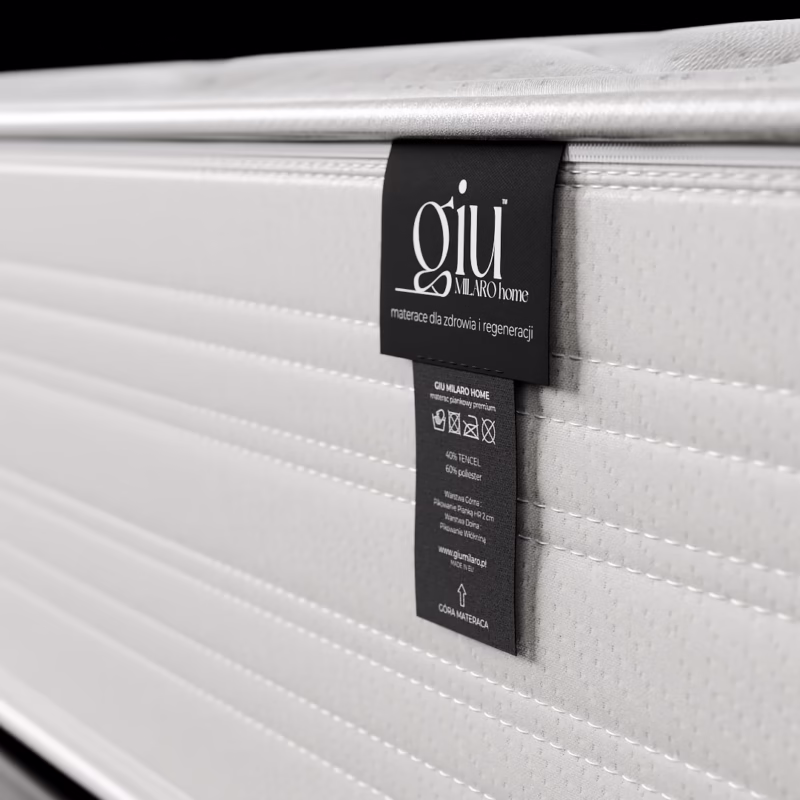 bok materaca giu z czarną metką i przeszyciami