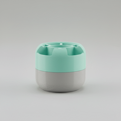 Dwukolorowy wydruk 3D przedstawiający nowoczesny, cylindryczny pojemnik z miętową górą i szarą podstawą, wykonany z tworzywa PLA na drukarce 3D FDM.