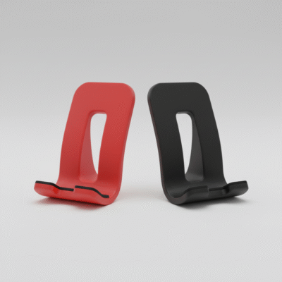 Dwa minimalistyczne uchwyty na telefon wykonane w technologii druku 3D, w kolorach czerwonym i czarnym, o nowoczesnym kształcie z otworem w tylnej części konstrukcji.